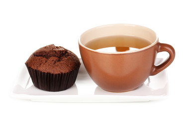Fresh muffin with tea isolated on white
