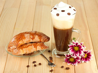 glass of fresh coffee cocktail and saucer with bagels