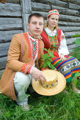 Young man and woman in national dress of Belarusian.