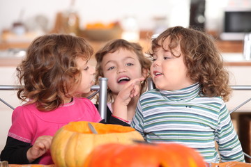 Fototapeta premium three kids in a kitchen at Halloween time