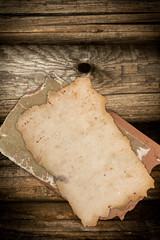 Damaged old papers on wood