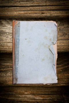Vintage old book on a wooden background