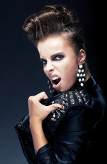 Subculture - punk female teenager, creative hairstyle screaming
