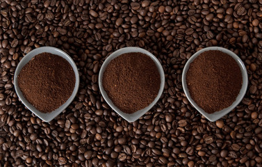 Ground coffee on coffe beans