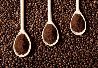 Ground coffee on coffe beans