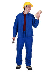 young bricklayer in jumpsuit