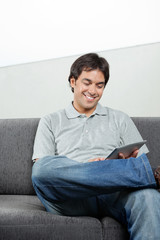Happy Man Using Digital Tablet