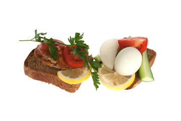 Rye-bread with canned fish, boiled egg, vegetables and parsley