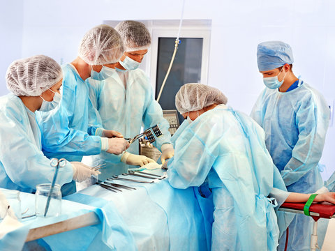 Surgeon at work in operating room.