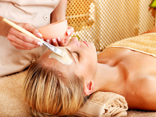 Woman getting  facial massage .