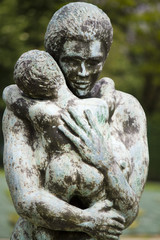 statue of woman holding child