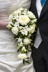 bride and groom with wedding bouquet