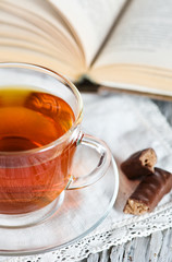 Cup of tea, candy and book