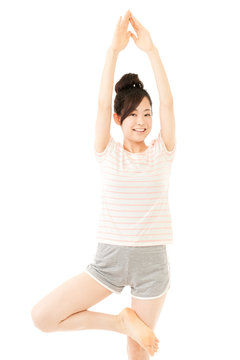 Beautiful young woman doing yoga. Portrait of asian.