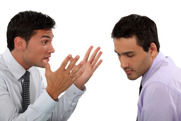 Two young businessmen having an argument