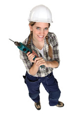 Tradeswoman holding a power tool