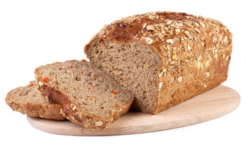 carrot bread on wooden cutting board, isolated on white