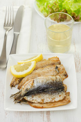 fried fillet of sardines with lemon