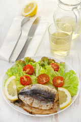 fried fillet of sardines with salad