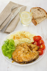 fish in sauce with mashed potato on the plate
