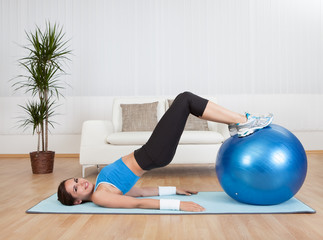 Woman Exercising With Exercise Ball