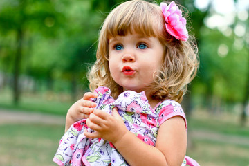 Caucasian little girl walking in the park