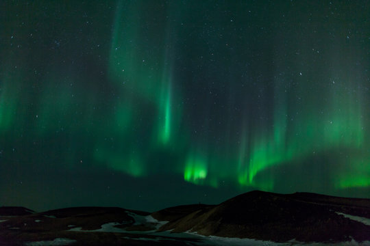 Northern lights over  craters in Iceland