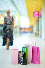 shopping bags in front of woman