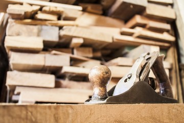 Old plane with planks on background