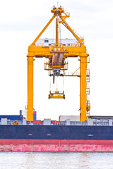 crane working with container cargo in shipyard
