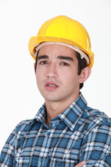 Builder with confused look on face