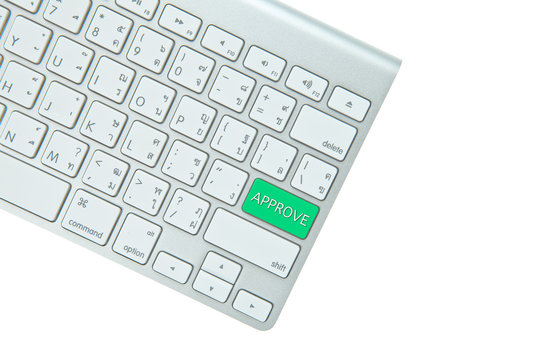 Green yes button on computer keyboard isolated on white backgrou