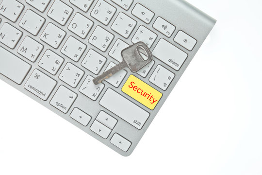 Key and security button on computer keyboard isolated on white b