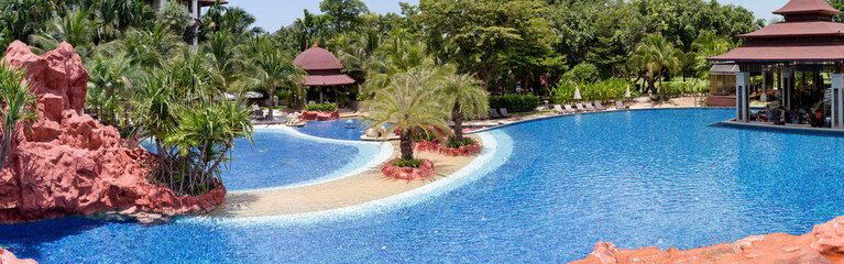 Fototapeta na wymiar Tropical resort at swimming pool