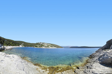 Fototapeta na wymiar panoramic view of a beautiful rocky beach in croatia, blue sea