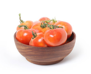 tomatoes in wooden bowl