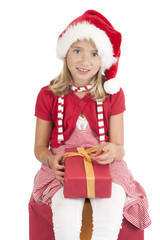 girl with christmas hat and present on white