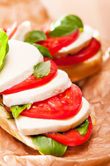Sandwich with mozzarella, tomato and basil