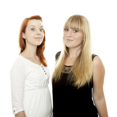young beautiful red and blond haired girls stand together