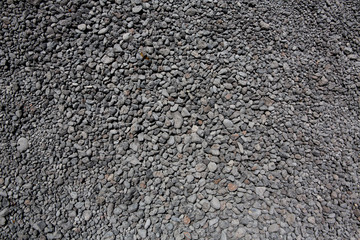 black gray volcanic lava rolling stones texture