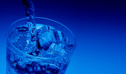 Pouring water into glass