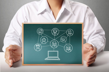  holding a blank blackboard