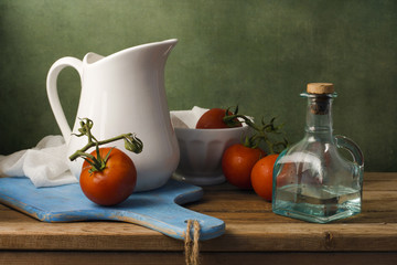 Still life with tomatoes and white jug