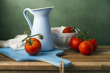 Still life with tomatoes and enamel jug © maglara