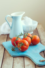 Still life with tomatoes and enamel jug