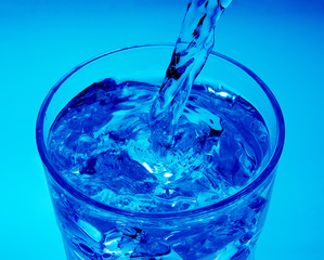 Pouring water into glass