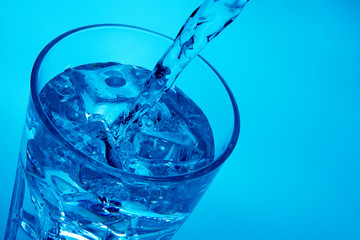 Pouring water into glass