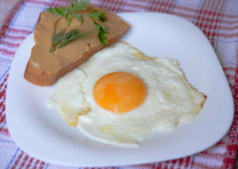 Breakfast - fried egg with pate sandwich