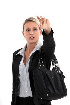 Young Woman Hailing A Cab