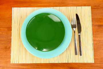 Table setting on wooden background close-up